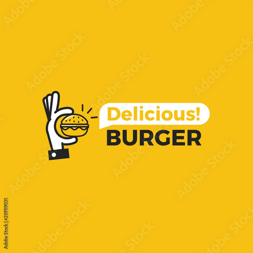 Delicious burger. Hand with a small hamburger.