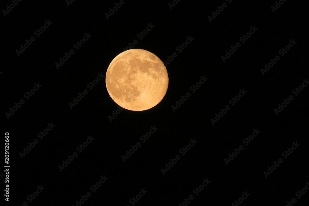 Full yellow moon in black sky background at the night Full yellow moon in black sky background at the night