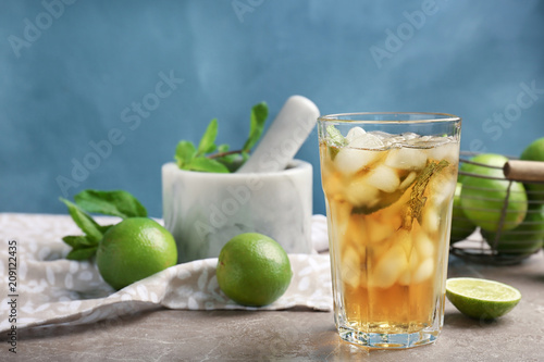 Composition with delicious mint julep cocktail on table