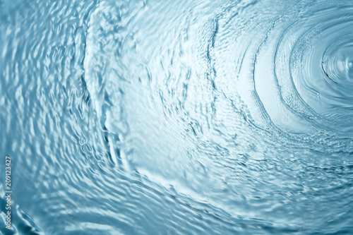 Background of blue clear water in motion with waves