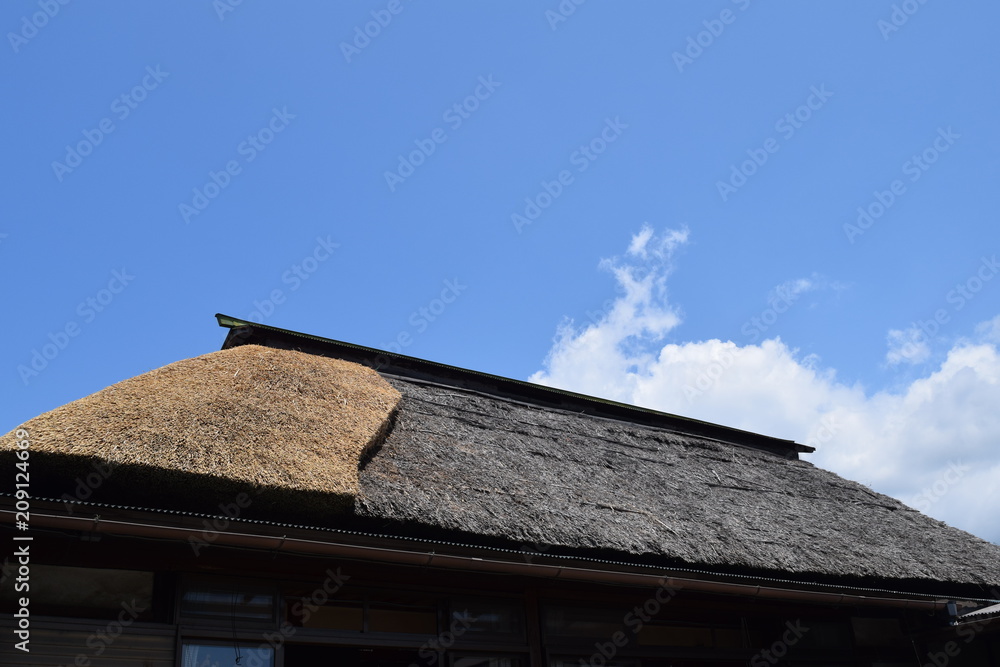 Fototapeta premium An old Japanese house with the thatched roof