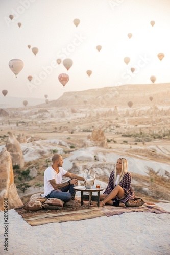 Romantic couple having a tea with a view in Cappadocia