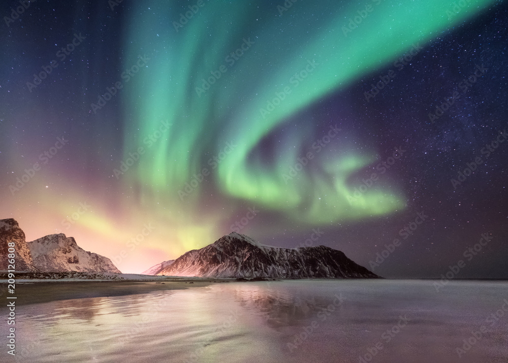 Northen light above mountains. Beautiful natural landscape in the Norway