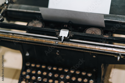 Details of an old retro typewriter, vintage style, dusty surfaces.