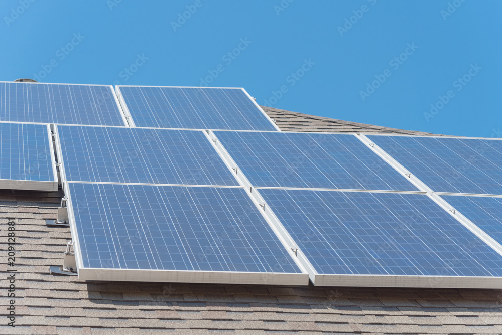 Close-up rail-less racking solar panel system on asphalt shingles ...