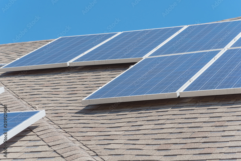 Close-up rail-less racking solar panel system on asphalt shingles ...
