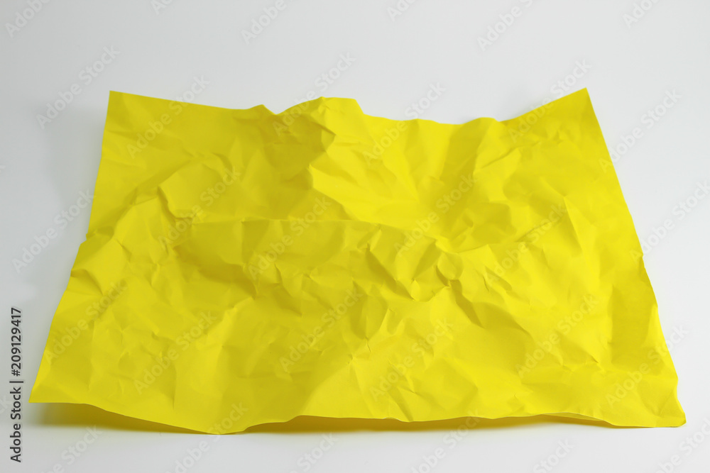 crumpled yellow paper