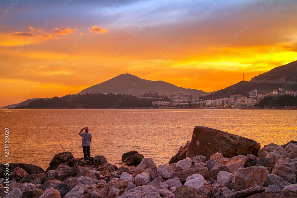 Colorful sunset on Adriatic sea,near the Budva city in Montenegro, gorgeous seascape and nature landscape