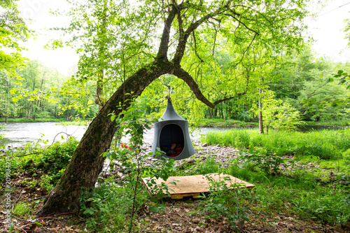 Cacoon hanging tent outside peaceful relaxation photo