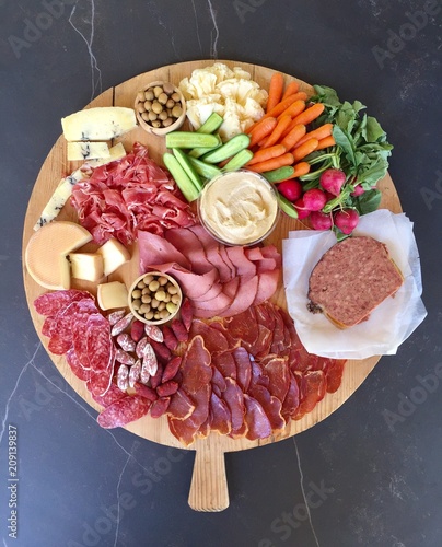 Appetizers on a vintage French wood board photo