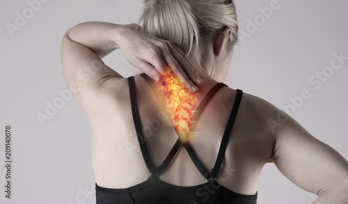 Woman suffering from back pain . Sports exercising injury.