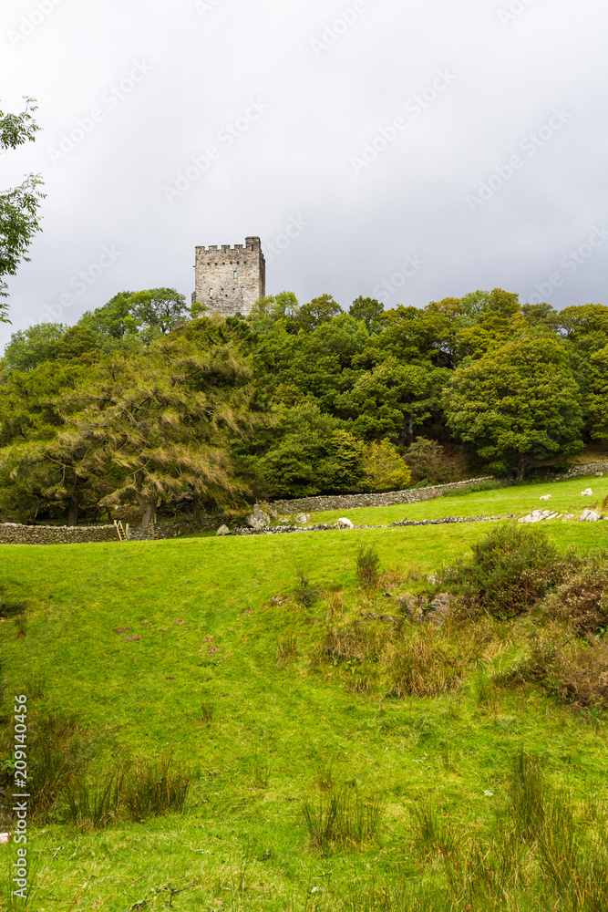 Castle Dolwyddelan from distance against cloudy sky Castle Dolwyddelan from distance against cloudy sky