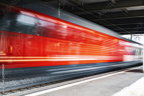 Speeding train through a European Station