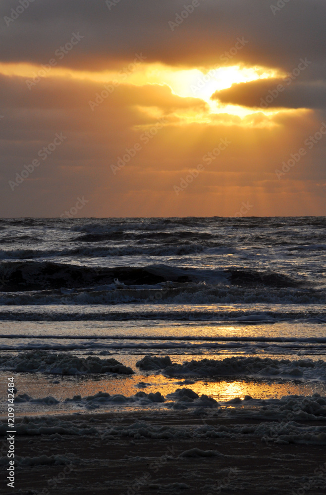 Landscape of the setting sun against the North sea in the Netherlands city of Zandvoort
