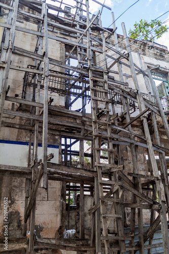 Wooden scaffolding holding a dilapidated building in Havana  Cuba.