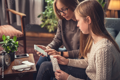 Periods. Menstrual cycle. Mother explains daughter the menstrual cycle and hygiene