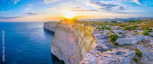Sunset view over Ta Cenc cliffs on Gozo, Malta