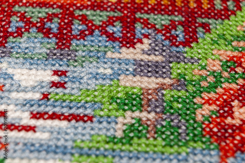 Cross-stitch. Macro photography of embroidery sites. Shooting with a small bluff of sharpness