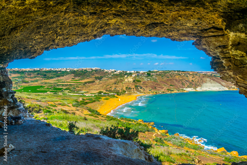 Foto Stock Aerial view of Ir-Ramla bay at Gozo through Tal-Mixta Cave, Malta  | Adobe Stock