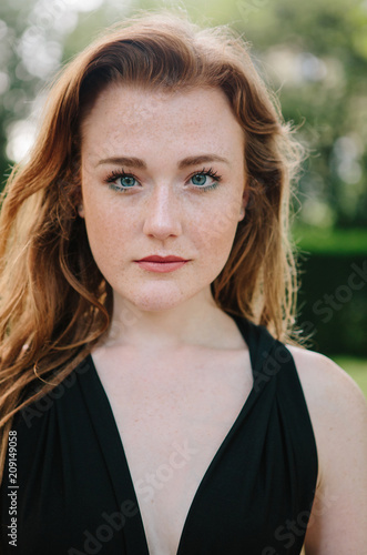 Beautiful woman with red hair and freckles