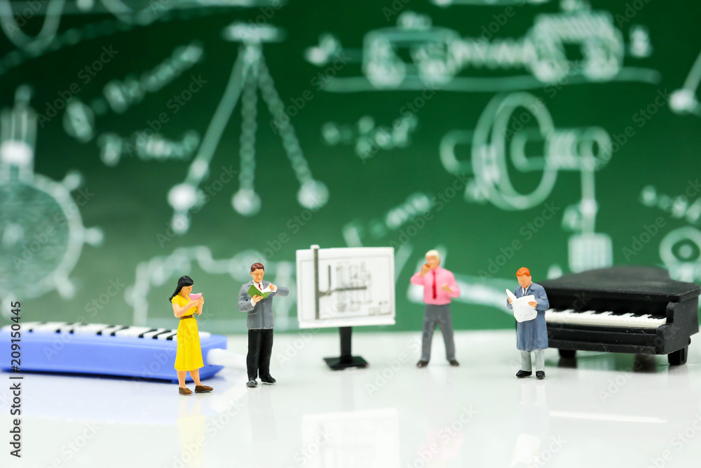 Miniature people : Teacher and student with piano class of music. Miniature people : Teacher and student with piano class of music.