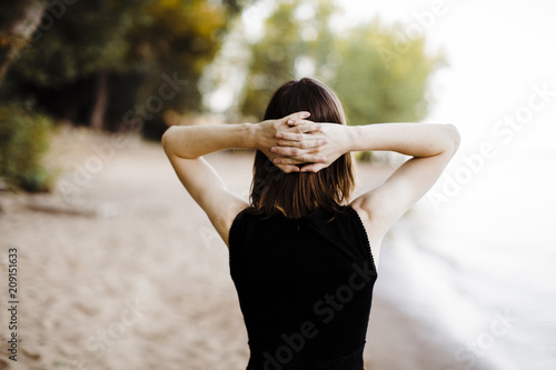 young androgyne man from behind photo