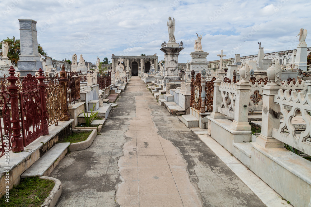 Obraz premium Tombs at Cementerio la Reina cemetery in Cienfuegos, Cuba. The cemtery was damaged by a hurricane.