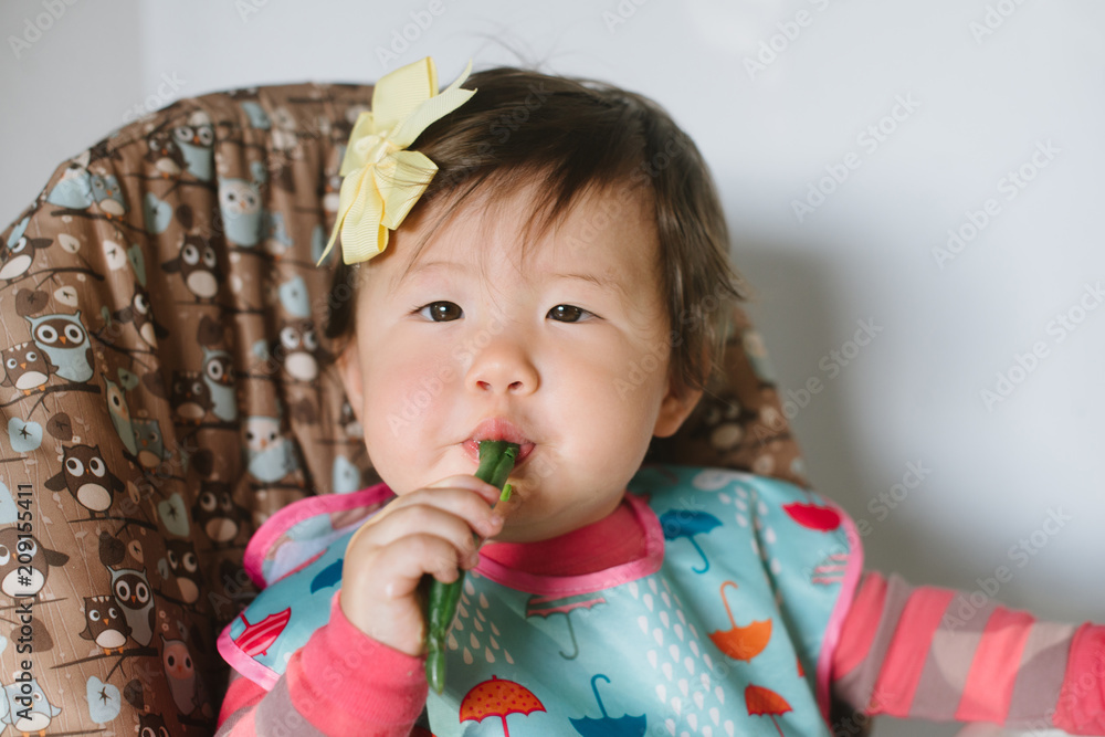 Baby eating green beans Baby eating green beans