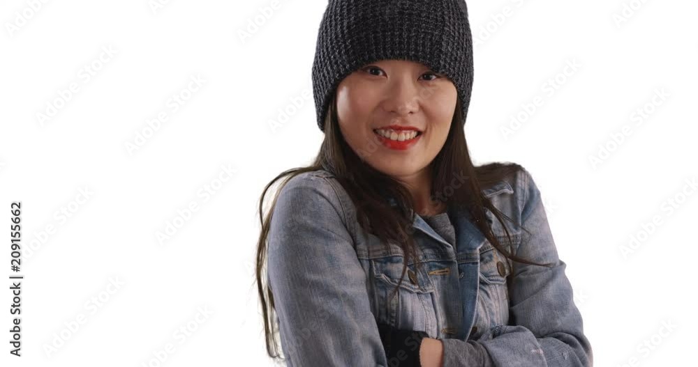 Freezing millennial woman trying to warm up with mittens and rubbing arms on copyspace, Close up of young Asian female using beanie and gloves to keep warm isolated on white background, 4k Freezing millennial woman trying to warm up with mittens and rubbing arms on copyspace, Close up of young Asian female using beanie and gloves to keep warm isolated on white background, 4k