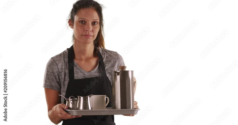Serious waitress carrying tray with coffee beverages on white background with copyspace, Unhappy attractive woman wearing apron and holding tray to serve coffee in studio, 4k Serious waitress carrying tray with coffee beverages on white background with copyspace, Unhappy attractive woman wearing apron and holding tray to serve coffee in studio, 4k