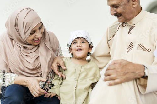 Muslim grandparents with their grandchild photo