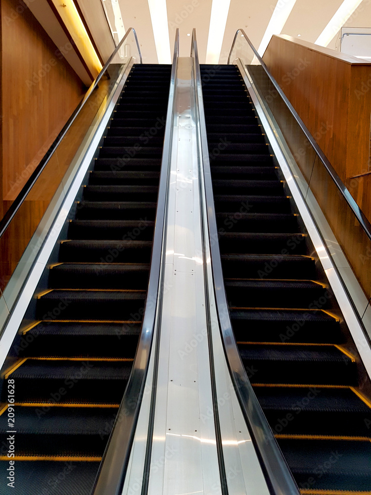 escalator or electric stairs front view of a mall escalator or electric stairs front view of a mall