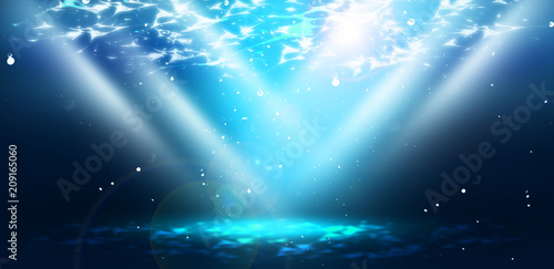 The depth of sea water, the underwater world, the rays of the sun through the water