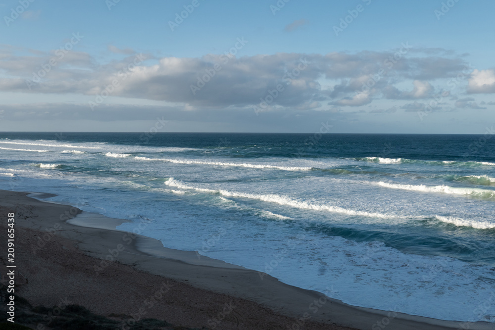 Empty beach with blue sky.