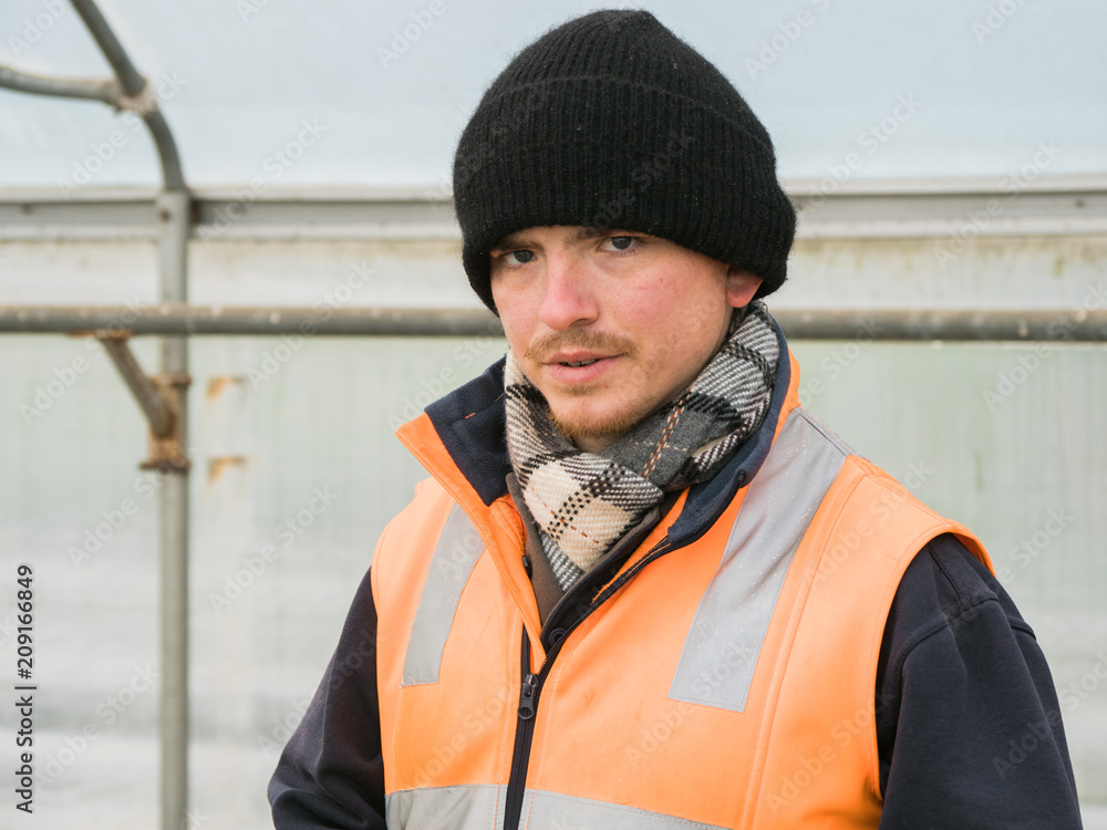 Young Man in Beanie and High Visibility Vest Young Man in Beanie and High Visibility Vest