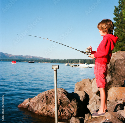 Young boy fishing on Lake Almanor photo