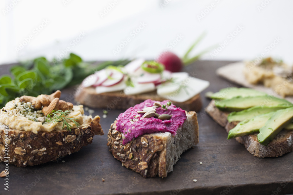 Wooden Tray of Assorted Vegetarian Vegan Sandwiches Wooden Tray of Assorted Vegetarian Vegan Sandwiches