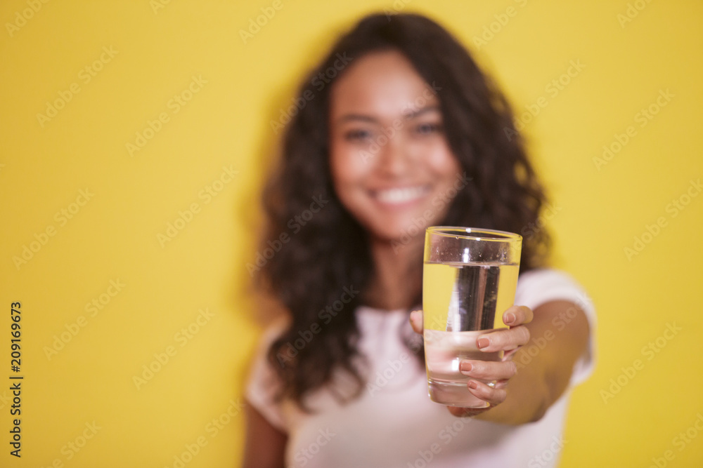 a glass of mineral water hold by asian girl a glass of mineral water hold by asian girl