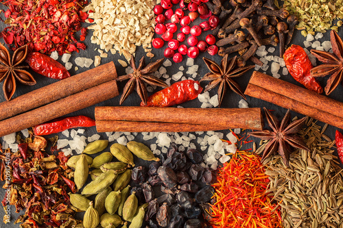  Aromatic Indian spices on a gray slate background