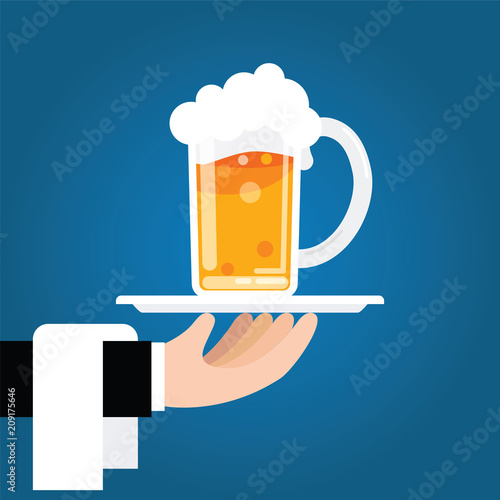 Waiter serving a glass of beer