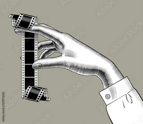 Woman's hand with a camera roll
