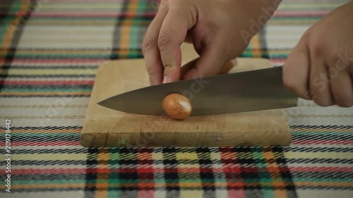 Cutting wieners on a wooden board photo