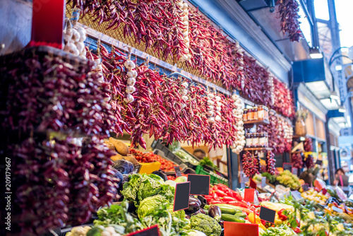 Counter filled with various vegetables and famous hungarian paprika in the great market hall in Budapest