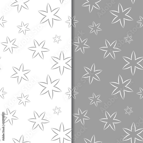 White and gray floral backgrounds. Set of seamless patterns