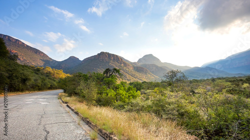 View of Blyde mountain range in South Africa with road going into distance. © RichTphoto