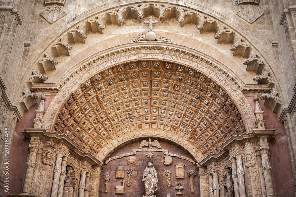 Detail artistic main door of cathedral or La Seu, gothic style in historic center of Palma, Balearic Islands.
