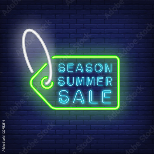 Season simmer sale neon sign. Green tag contour with white string on brick wall. Night bright advertisement. Vector illustration in neon style for consumerism and retail