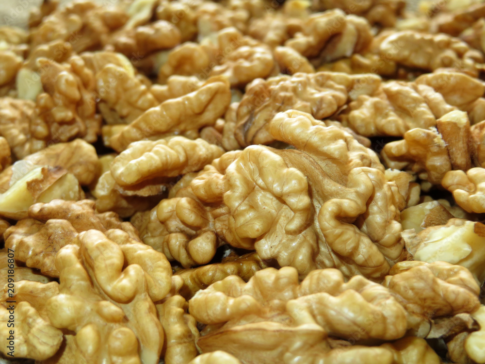 Peeled walnut kernels. Heap of walnuts closeup Peeled walnut kernels. Heap of walnuts closeup