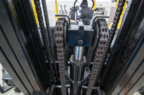 Close up forklift chain, Oiled mechanical chain on a forklift truck