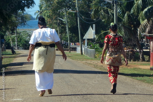  Traditionally dressed Tongan women going to church on Sunday at Neiafu, Vavau, Tonga photo